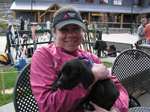 Dr Karen Anderson holding a puppy at Sugarbush Vermont 